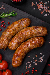 Delicious fried grilled sausages with salt, spices and herbs