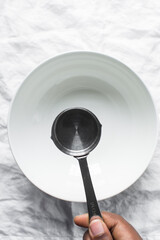 top view of a metal measuring cup, empty measuring  cup used for baking