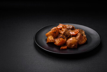 Delicious fresh cooked stew with pork meat or beef with potatoes, carrots, spices and herbs