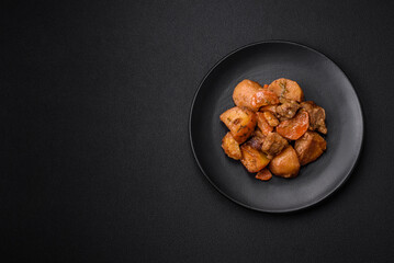 Delicious fresh cooked stew with pork meat or beef with potatoes, carrots, spices and herbs