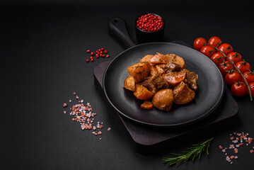 Delicious fresh cooked stew with pork meat or beef with potatoes, carrots, spices and herbs