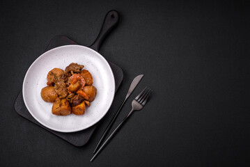 Delicious fresh cooked stew with pork meat or beef with potatoes, carrots, spices and herbs