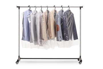Clothing rack at dry cleaners with suits hanging