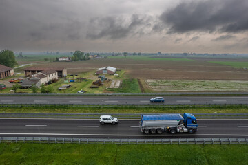 Cargo trucks and cars in the motorway high point of view
