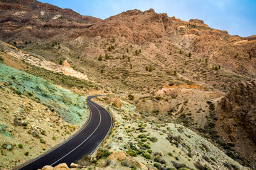The beauty of nature on the TF-21 road with breathtaking eroded and colorful rocks with green shades at the Azulejos viewpoint, surrounded by the Las Cañadas del Teide National Park on Tenerife.
