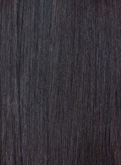 Close up of a section of glossy straight brown hair. Showing hair treatment results after keratin straightening