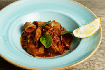 Calamari with Spicy Tomato Sauce and Lemon