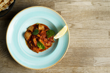 Calamari with Spicy Tomato Sauce and Lemon