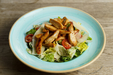 Caesar Salad with Grilled Chicken Stripes