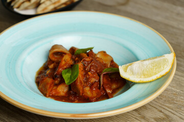 Calamari with Spicy Tomato Sauce and Lemon