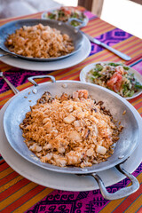 rice with shrimp on a metal pan and accompaniment from the Colombian tropics