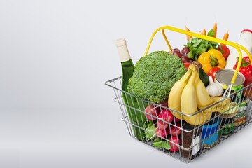 Different tasty fresh vegetables in shopping basket