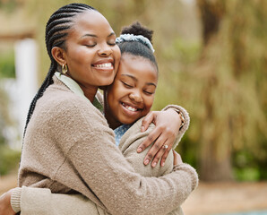 The bond between mother and daughter. Cropped shot of an attractive young woman and her daughter embracing outdoors.