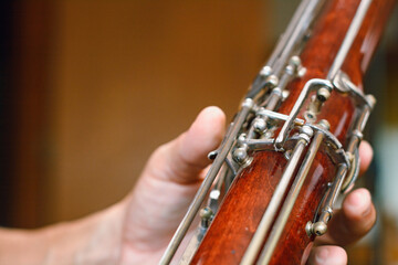 closeup of bassoon instrument body with blurred background and copy space