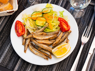 Dish with fried sardines, pilchards or anchovies in batter for a traditional Spanish meal