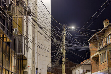 Electric pole wires in Prizren city by night