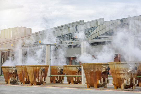 Large rustic foundry casting crucible smelting pots. Hot slags in the crucible in the copper processing factory. Copper slag is a by-product of copper extraction by smelting.