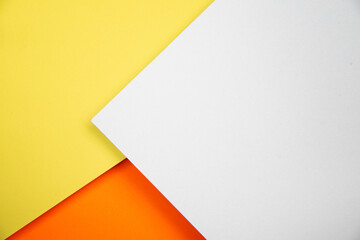 Beautiful 3-D background made of colored paper. Yellow, orange and white.