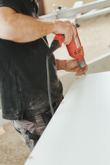 Detail in focus: a red drill used by the woodworker