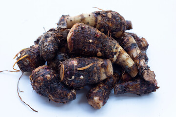 Organic taro fruit on white background.