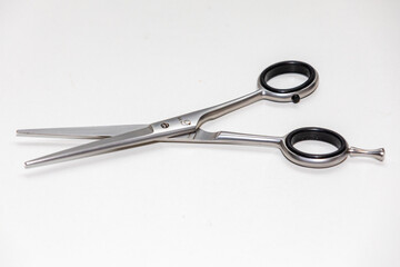 Traditional metallic scissors isolated on white background