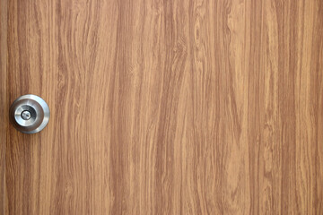 Vintage wooden door with metal bolts.