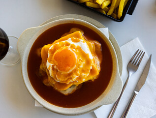 Francesinha - typical food from Porto. Portuguese cuisine