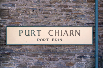 Bilingual signboard in English and Manx of the terminal station of the narrow-gauge steam railroad in Port Erin, Isle of Man