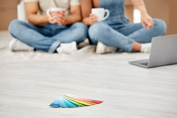 Choose a colour that will reflect your style. Closeup shot of colour swatches on the floor with an...