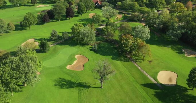 Aerial view of a suburban Chicago golf course in early morning with fairways and sand traps in Glencoe, IL.