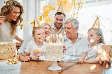 Time flies by, take every opportunity to celebrate it. Shot of a happy family celebrating a birthday at home. - Powered by Adobe