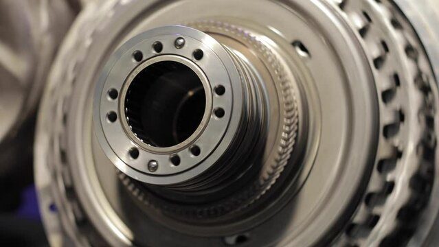 Gear mechanism process Rotating gears. works from within. movable clutch disc. Close-up.