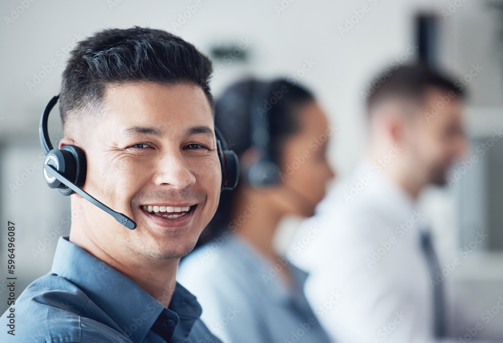 Aufkleber His problem solving capabilities are excellent. Portrait of a young call centre agent working in an office with his colleagues in the background.