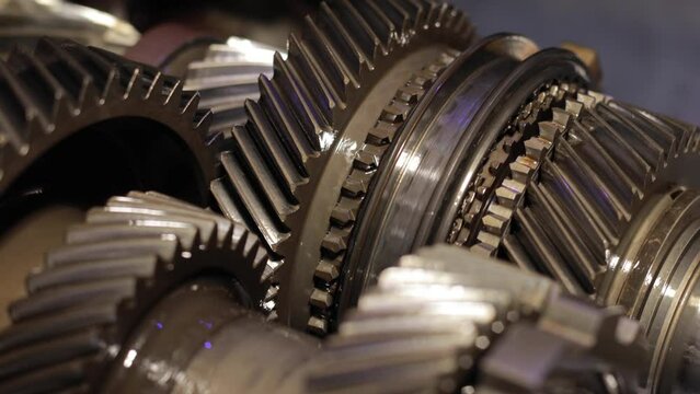 Gear mechanism process Rotating gears. works from within. movable gearbox. Close-up. Gearbox gears isolated