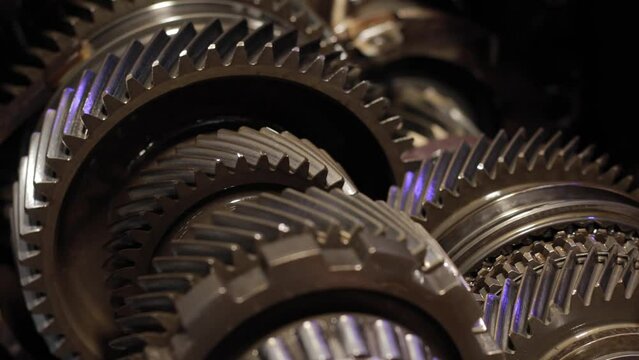 Gear mechanism process Rotating gears. works from within. movable gearbox. Close-up. Gearbox gears isolated
