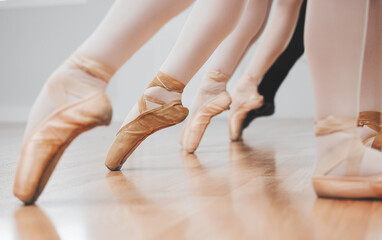 Ballet is incredible to watch. Shot of a group of ballerinas with toes pointed. - obrazy, fototapety, plakaty