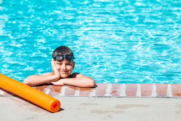 Oudoor summer activity. Concept of fun, health and vacation. A happy boy eight years old in...