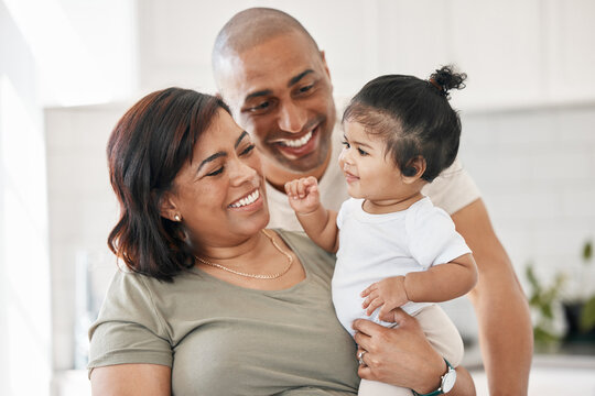We cherish all these little moments. Shot of a young family spending time together at home.