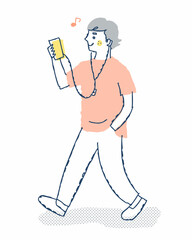 Obraz premium スマホで音楽を聴きながら歩く若い男性