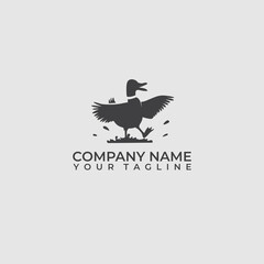 Fototapeta premium Logo silhouette of a duck playing in the mud happily. Vintage duck logo design.
