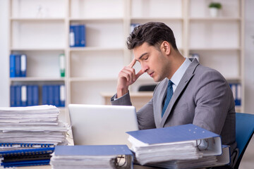 Young male employee working in the office