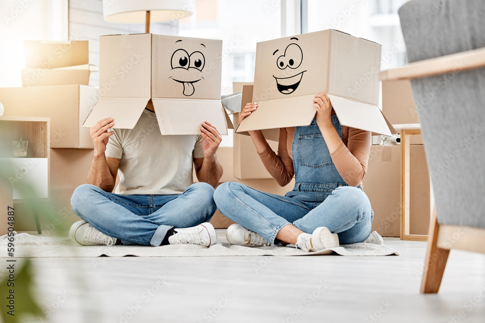 Poster silly times in abundance. shot of a couple wearing boxes with smiley faces drawn on them on their he