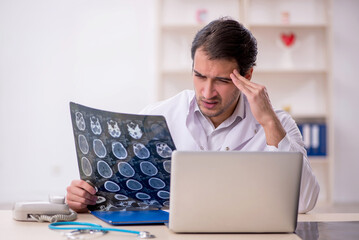 Young male doctor radiologist working in the clinic