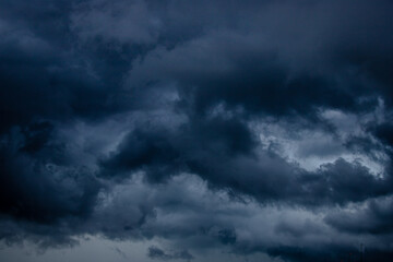 Fototapeta na wymiar Dark stormy sky with heavy clouds. Climate change concept.