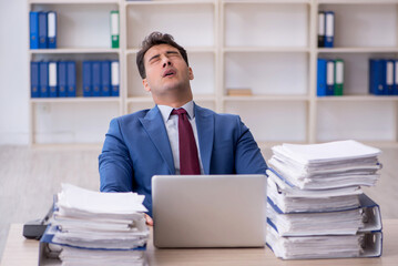 Young male employee working in the office