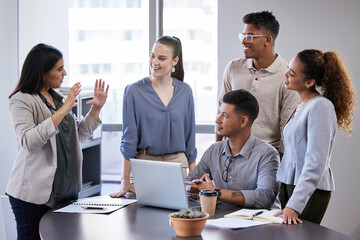 Always look at the bigger picture. Shot of a group of businesspeople having a meeting in a modern...