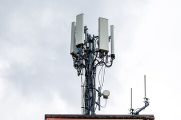 Cell phone transmission systems on the roof of an apartment building in East Toronto, Ontario Canada