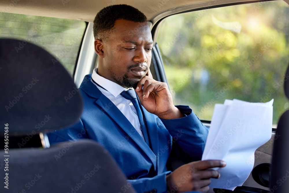 Aufkleber making sure the paperwork is in order. cropped shot of a handsome businessman looking over paperwork