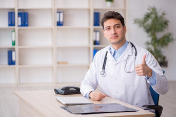 Young male doctor working in the clinic