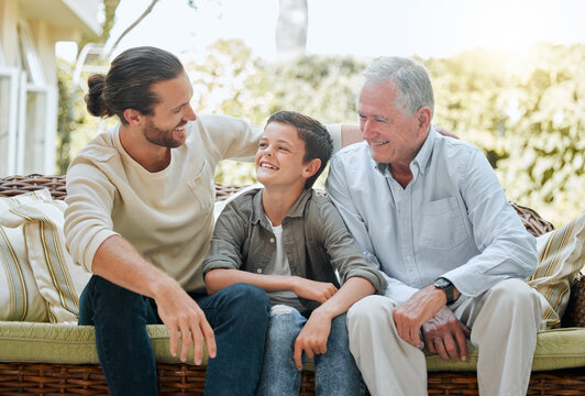 Sorry Dad, grandpa is my favourite. Shot of a man sitting outside with son and his elderly father.
